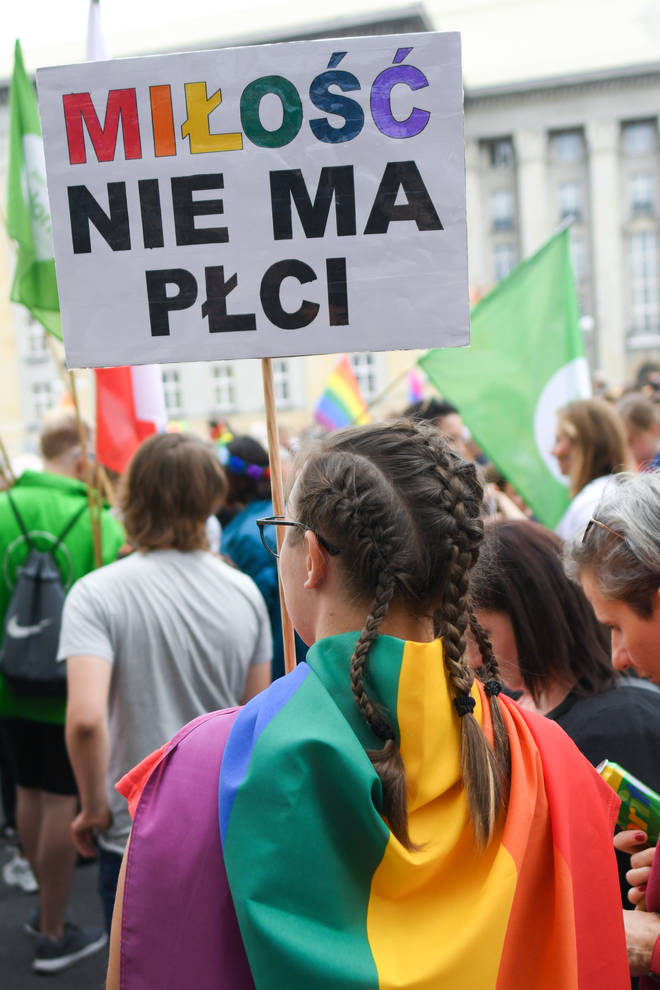 A participant holds 'Love Has No Sex' sign during the Equality March 2019  through Katowice, Poland