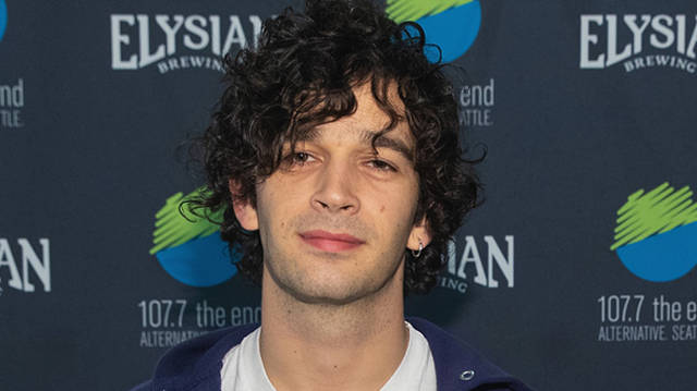 Matty Healy of The 1975 poses for a photo backstage during Deck The Hall Ball