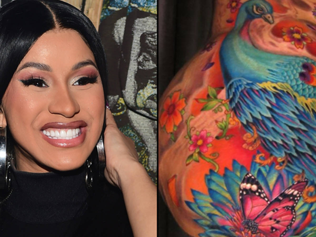Cardi B shows off her gigantic revamped peacock tattoo on her leg - PopBuzz