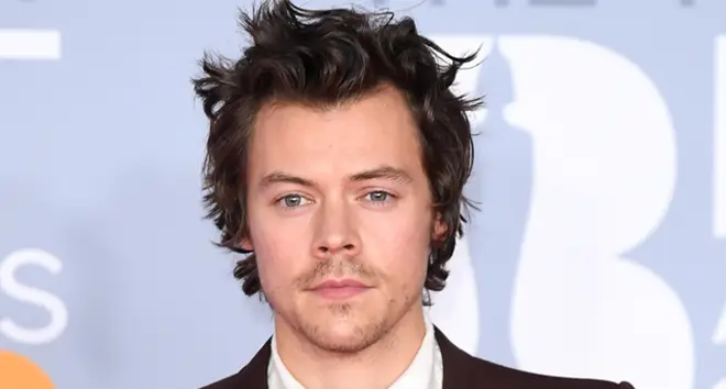 Harry Styles' new movie suspended filming after a coronavirus diagnosis on set.
