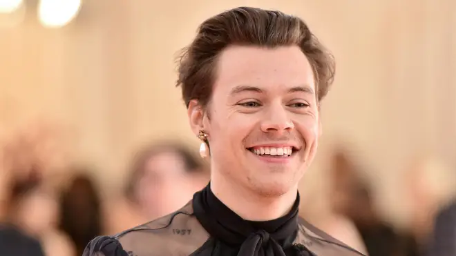 Harry Styles says he loves women's clothing as he covers Vogue in a dress