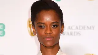 Letitia Wright poses with her award in the press room during the EE British Academy Film Awards