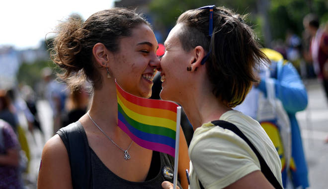 Two women react during the Gay Pride parade on September 17, 2017 in Belgrade.