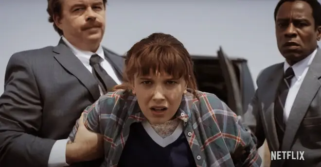 Eleven appears to be kidnapped by men in suits in Stranger Things 4