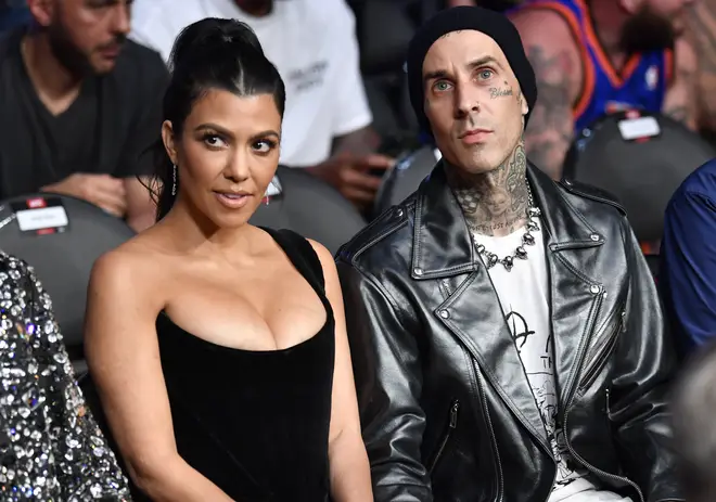 Kourtney Kardashian and Travis Barker are seen in attendance during the UFC 264 event
