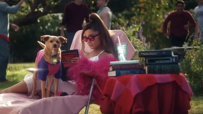Ariana's Legally Blonde tribute features a book about Immigration and Refugees