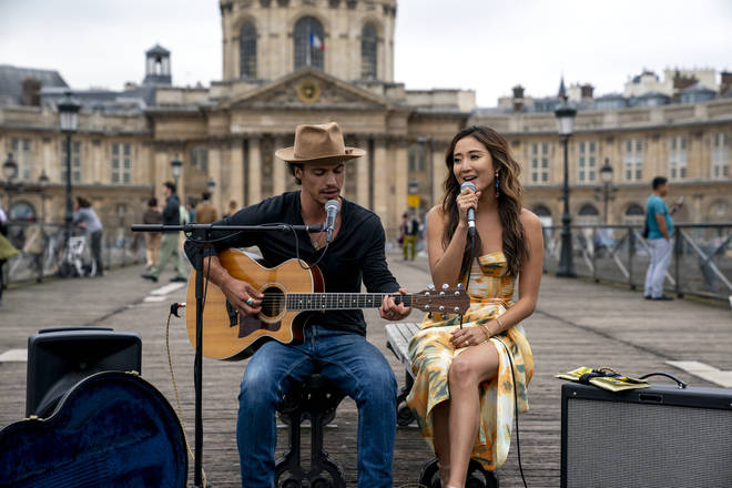 Emily In Paris season 2: Benoit (Kevin Dias) and Mindy (Ashley Park) busk in Paris