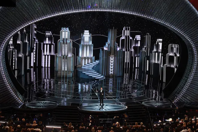 Host Jimmy Kimmel delivers a speech on stage at the 89th Oscars.