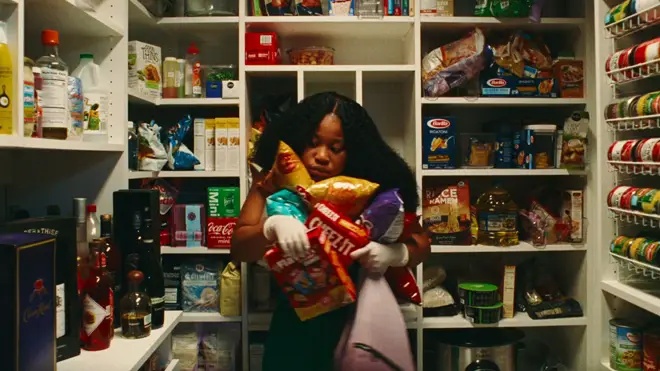 Dre stealing food after murdering someone in Swarm episode 3