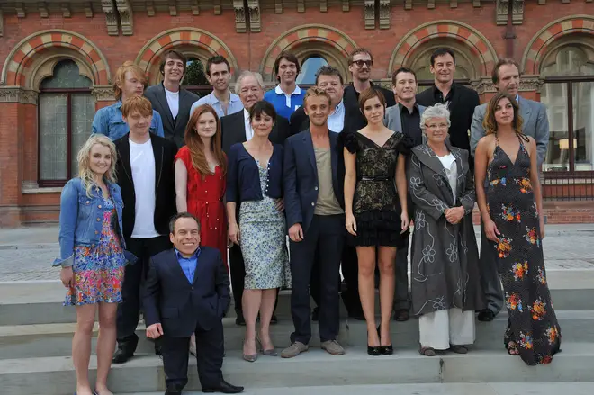 Sir Michael Gambon poses with the cast of Harry Potter in 2011