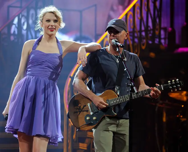 Taylor Swift performs with Kenny Chesney on the Speak Now World Tour