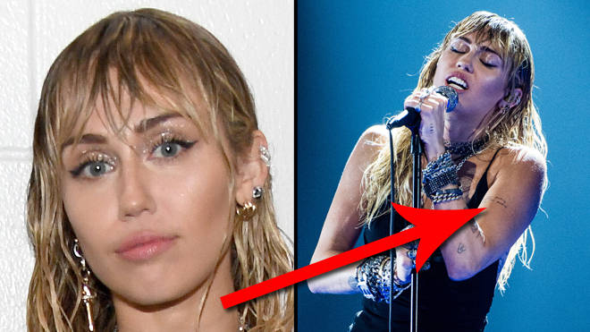Miley Cyrus unveils new Liam Hemsworth divorce tattoo at the VMAs
